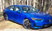 2026 Acura Integra A-Spec in blue features a stick-shift manual transmission