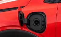 A 2027 Chevrolet Bolt is shown sporting a new NACS Tesla-style charger port