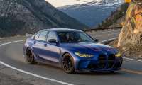 2027 BMW M3 driving in the mountains