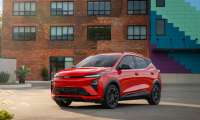 Red 2027 Chevrolet Bolt shown from the front three-quarter view.