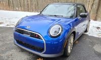 2025 MINI Cooper S Convertible looks out of place in a winter scene