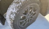 A Yokohama Geolandar tire is shown conquering snow