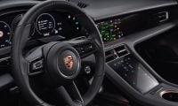 Interior of a Porsche Cayenne showing dashboard with touch screens