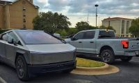 Tesla Cybertruck parked beside a Ford F-150 Lightning