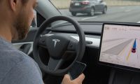 Tesla driver texting while using full self-driving