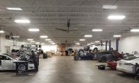 A busy Tesla service center repairs Tesla cars 
