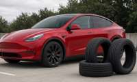 A red Tesla Model Y with a new set of tires