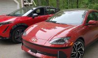 A Hyundai Ioniq 6 and Nissan Ariya sit side by side in brilliant red