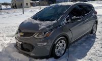 A Chevrolet Bolt charges in arctic temperatures outside