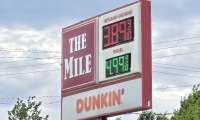A gasoline station sign in Greenville, NH shows gas at well under $4/gallon