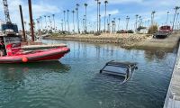 A Tesla Cybertruck is shown completely submerged in water in Ventura California