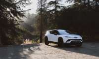 Image showing a white Fisker Ocean parked in a forested area.