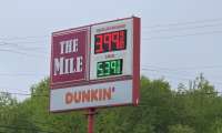 A gas price sign show $3.99 in Greenville New Hampshire