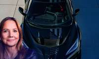 GM's Mary Barra and a Chevy Corvette