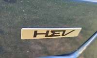 A hybrid logo from Kia is shown