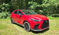 2026 Lexus NX350H sits against a rural backdrop