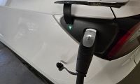 A Tesla is shown charging