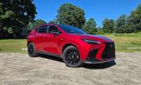 A 2026 Lexus NX is shown in brilliant red
