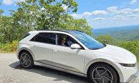 Image of Hyundai Ioniq 5 atop a mountain in fall