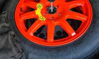 The spare tire of a Range Rover Sport hybrid is shown