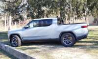 A Rivian R1T is shown for sale