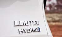 A Toyota Limited Hybrid Logo is shown on a white Sienna