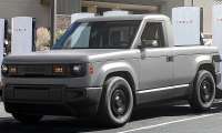 Slate EV Truck supercharging at a Tesla Supercharger