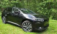 2026 Subaru Solterra Limited looks brilliant against a lush rural backdrop