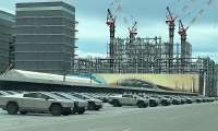 SpaceX visitor pictured hundreds if not more Tesla Cybertrucks evenly parked at SpaceX parking lot.