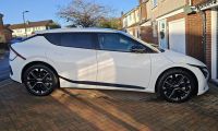 White Kia EV6 outside of owner’s home