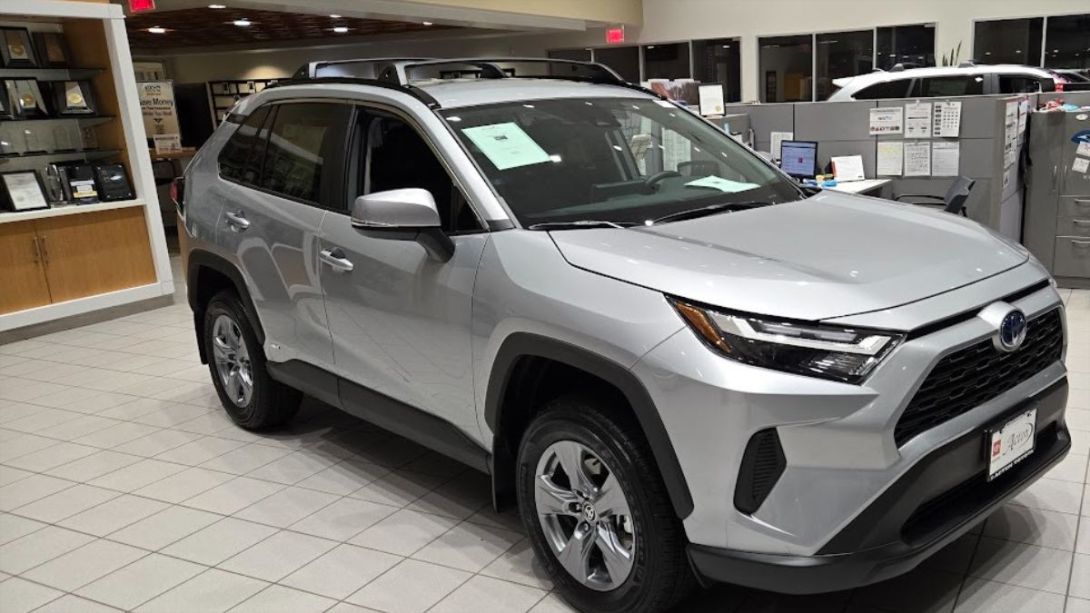 A Toyota RAV4 Hybrid awaits a buyer at a Toyota dealership