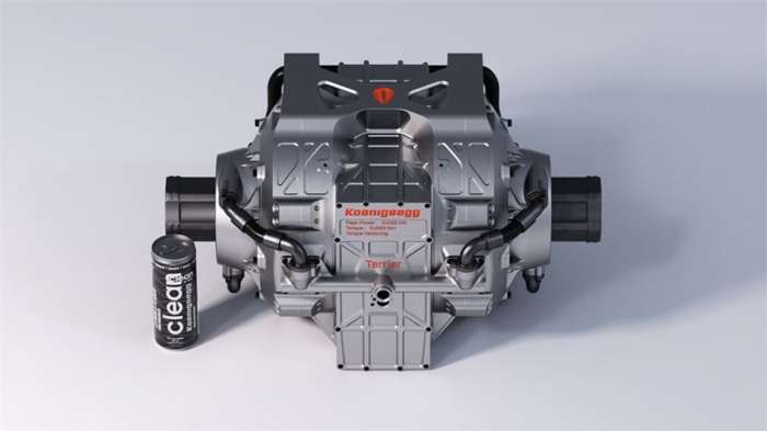 Image showing one of Koenigsegg's Terrier electric drive units beside an energy drink can for scale.