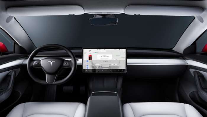 Interior Of Typical Tesla Vehicle And Its Main System Display
