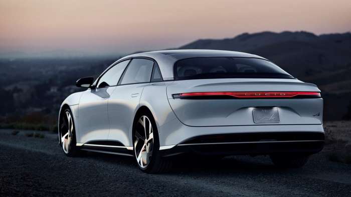 Rear view of a white Lucid Air at sunset.